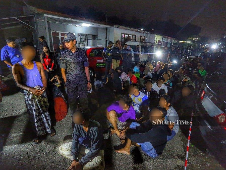 The Immigration Department has detained 69 illegal immigrants, including a two-year-old boy, in a raid on a squatter settlement at Kampung Pantai Dalam this morning. - NSTP/Saifulizan Tamadi