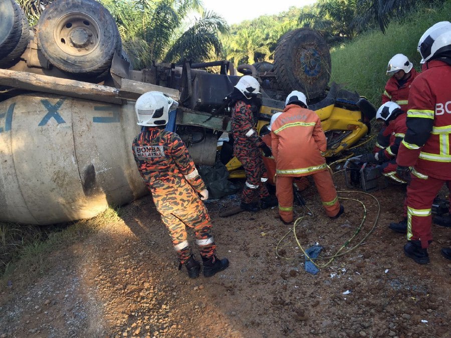 The driver of a cement mixer lorry died after losing control of the vehicle and overturned on Jalan Lucia, Kampung Serudung Baru here late yesterday afternoon. - Pic courtesy BOMBA