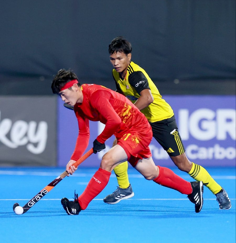China (in red) and Malaysia in action in Monday’s Olympic Qualifier in Muscat, Oman. - Pic credit FIH
