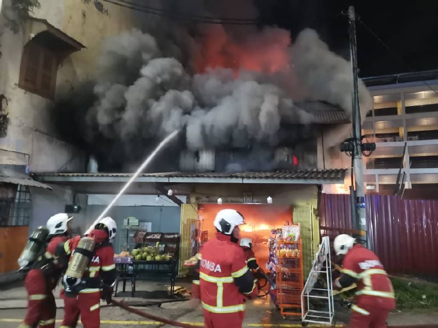 Two grocery stores on Bunga Raya Street here were razed in a fire last night. A 10-second video recording of the fire has been circulating since this morning and shared on social media platforms. - Pic credit JBPM Melaka