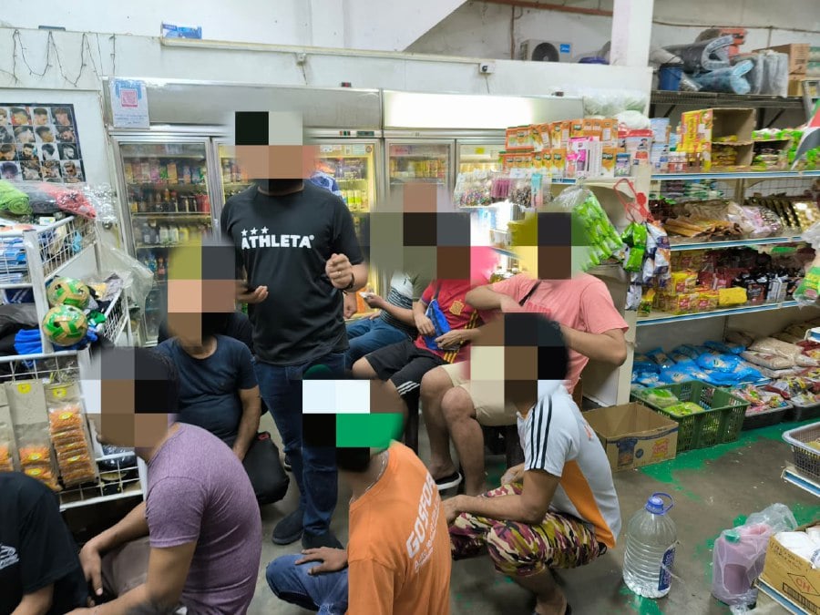 Johor Immigration Department enforcement unit officers detained 65 undocumented foreigners, in a two-day raid in Johor Baru and Mersing. - Pictures courtesy of Johor Immigration Department.