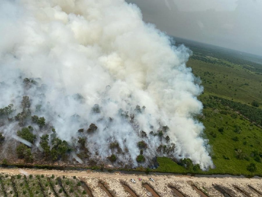 Aerial view of the peat fire in Sg Adong. -- Pic courtesy of MMEA
