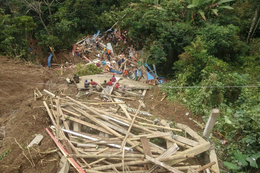 This handout photo released on April 14 by the National Search and Rescue Agency (Basarnas) shows a landslide site in Tana Toraja, South Sulawesi. AFP PIC/BASARNAS