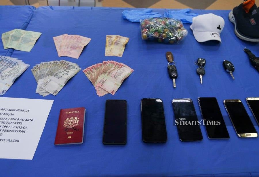 Also seized from the suspect were an international passport and a packet of 'bola mercun' (fireball), a type of firecracker, as well as a car– a Honda Civic– and four identification cards belonging to several individuals. - NSTP/NIK ABDULLAH NIK OMAR
