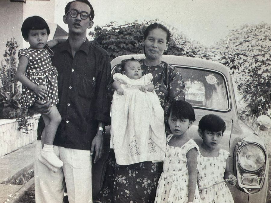  A three-year-old Datuk Noraina being held by her father, Pak Samad with her mother and other siblings. - NSTP file pic