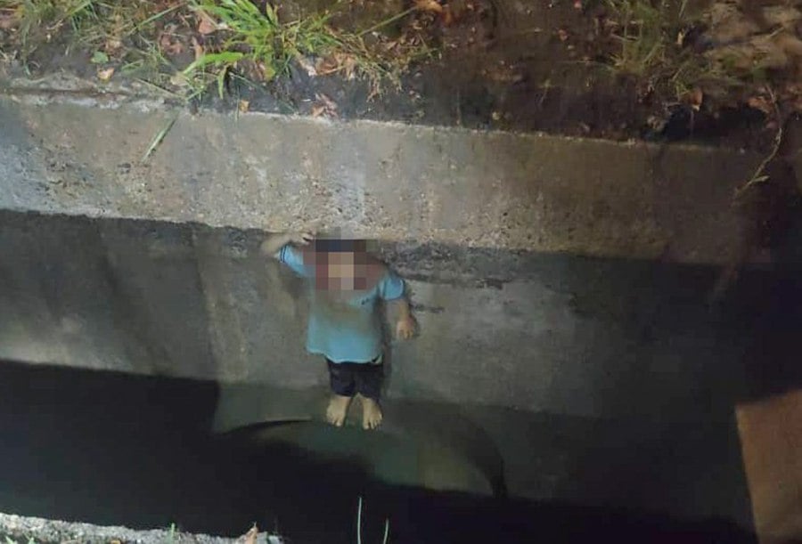 The boy was rescued after falling into a drain at an apartment in Ampang. -- Pic courtesy of Selangor Fire and Rescue Dept