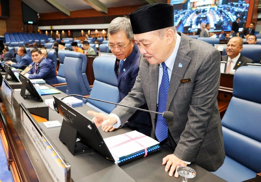 Sabah Chief Minister Datuk Seri Hajiji Noor (right)during the state assembly sitting here. -- Pic courtesy of Sabah Chief Minister's office.