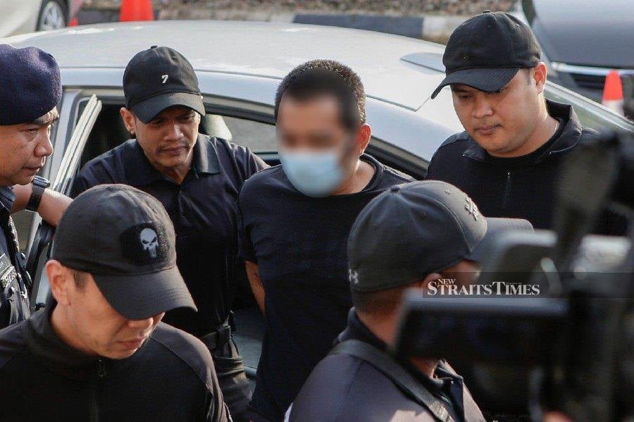 Hafizul Hawari, the suspected gunman involved in the Kuala Lumpur International Airport (KLIA) incident, arrived at the court complex today to face several charges. - NSTP/AIZUDDIN SAAD