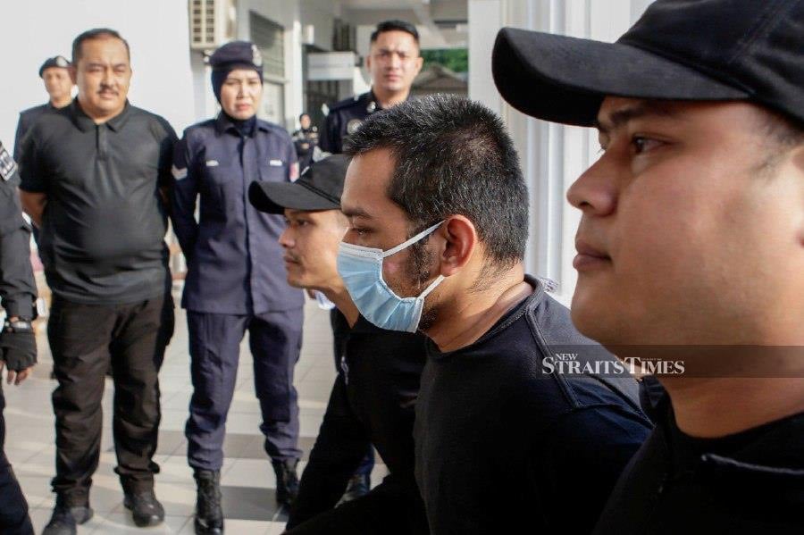 The suspected Kuala Lumpur International Airport gunman, Hafizul Hawari, pleaded not guilty to charges of attempted murder on his wife and voluntarily causing grevious hurt by a dangerous weapon on her bodyguard on April 14. - NSTP/AIZUDDIN SAAD