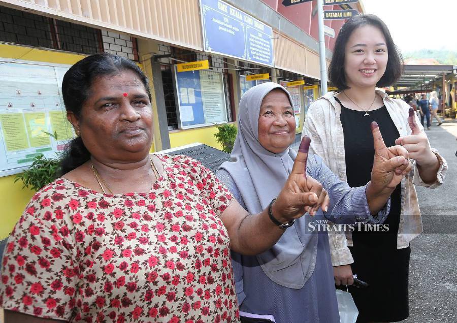 (From left) Puspa Ramasamy, 60, Zaidah Alias, 66, Hew Thong Yau 26 finished voting at SMK Kuala Kubu Bharu in conjunction with the by-election (PRK) of the Kuala Kubu Baharu state seat by-election. - NSTP/SAIFULLIZAN TAMADI