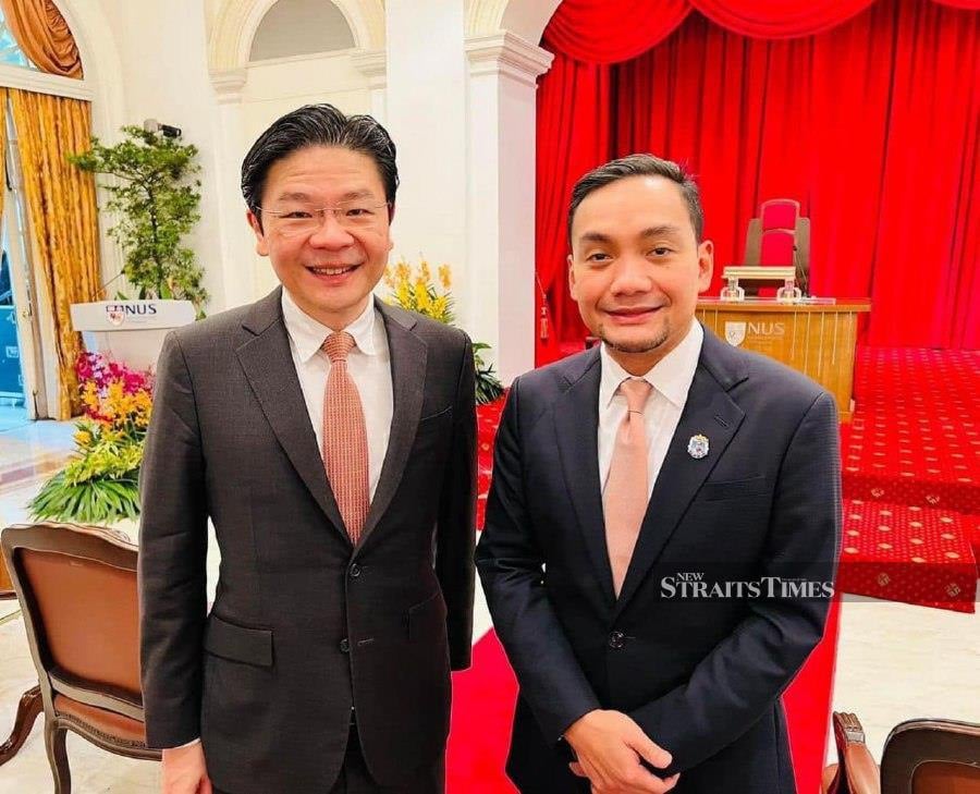 Johor menteri besar Datuk Onn Hafiz Ghazi (right) extends his congratulations to incoming Singapore Prime Minister Lawrence Wong (left) on behalf of the state government. - Pic courtesy of FB ONN HAFIZ