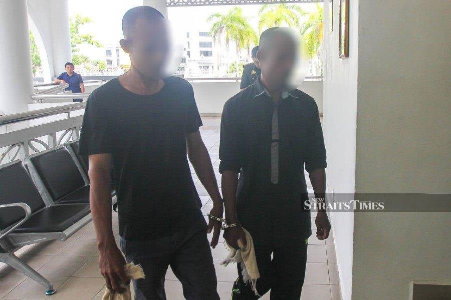 Zaw Min Naing, 45, and U Kyaw Hla, 39, who initially claimed trial to the charge, entered a guilty plea to an amended charge during the trial yesterday. - NSTP/WAN NABIL NASIR