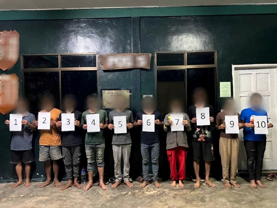 A total of 10 Myanmar nationals who entered the country illegally were nabbed by the army near the Malaysia-Thailand border here yesterday. - Pic courtesy of the Malaysian Army