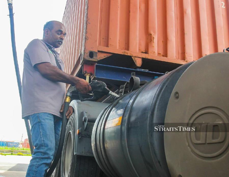 Commercial trailer driver, Deventheren Parasuraman, 50, said his employers have already obtained fleet cards after receiving the Subsidised Diesel Regulation System (SKDS) approval to continue enjoying diesel subsidies from the government. Pic by Wan Nabil Nasir 