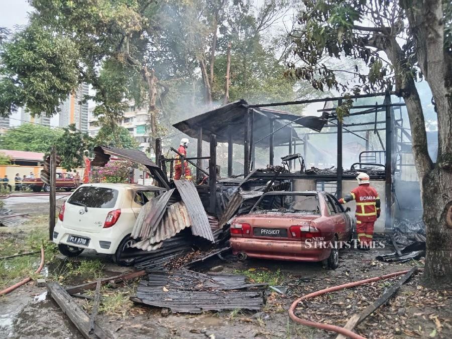 A family of seven faced some tense moments when their house near Taman Desa Penaga, Jelutong, was razed by fire this morning. Pic courtesy of Fire and Rescue Department 