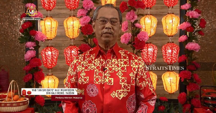Prime Minister Tan Sri Muhyiddin Yassin delivers his speech during the first virtual Chinese New Year open house celebration. 