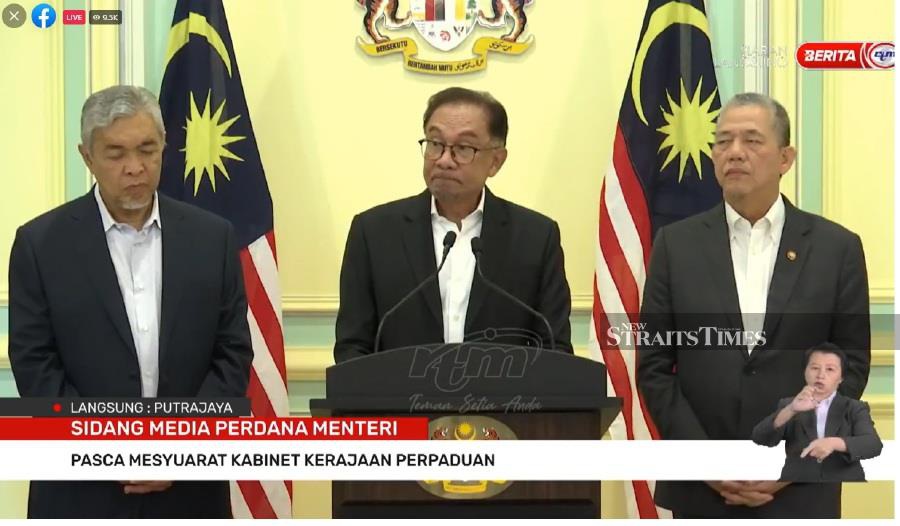 Prime Minister Datuk Seri Anwar Ibrahim (centre) speaks during a special Press conference earlier today. - Screengrab via social media. 