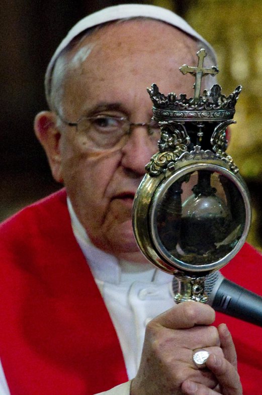 Pope Francis holds the ampulla that contains the blood of San Gennaro (Saint Januarius, patron of Naples) during his visit at the Duomo cathedral in Naples, Italy. Pope Francis is on a one-day visit to Naples and Pompeii. EPA PHOTO