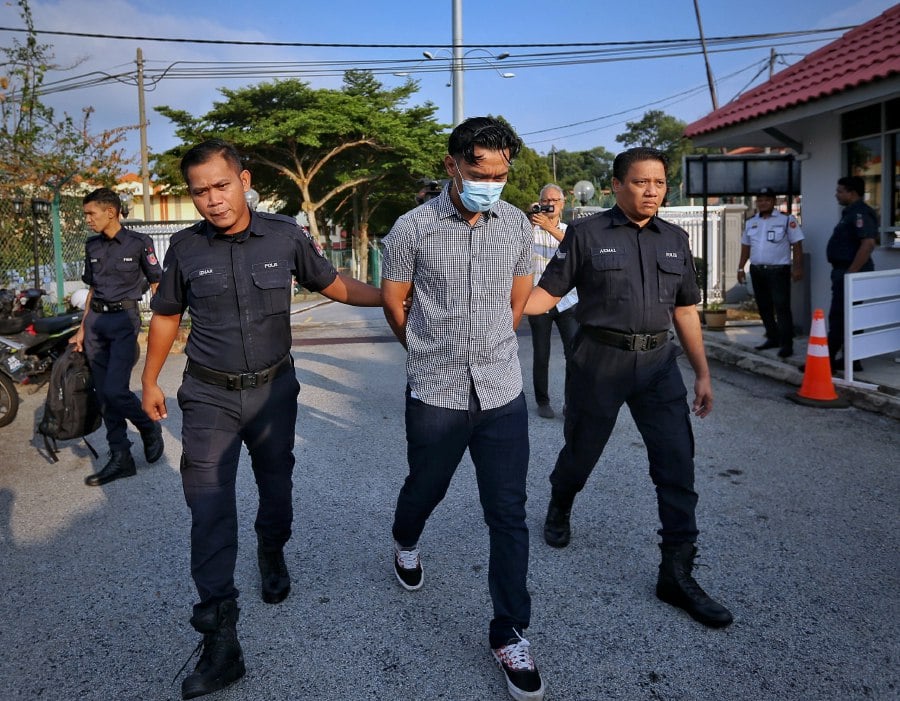 The accused being brought to court today. -- NSTP/AZRUL EDHAM