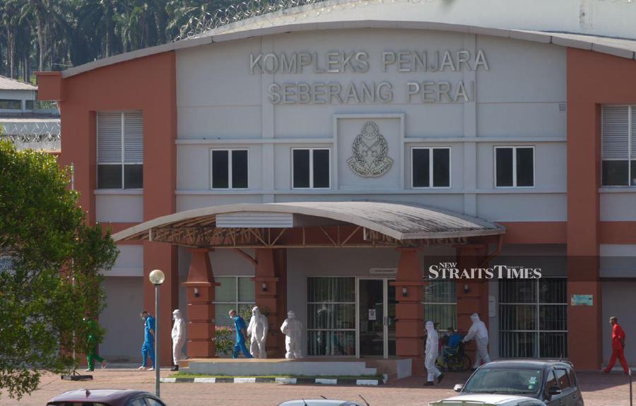 Checks by the New Straits Times at the prison this morning showed health officials making their way into the prison for swab tests. - NSTP/DANIAL SAAD.