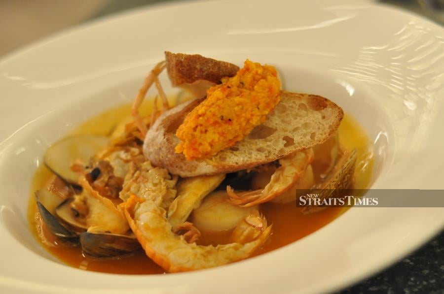  Bouillabaisse, seafood poached in tomato sauce.
