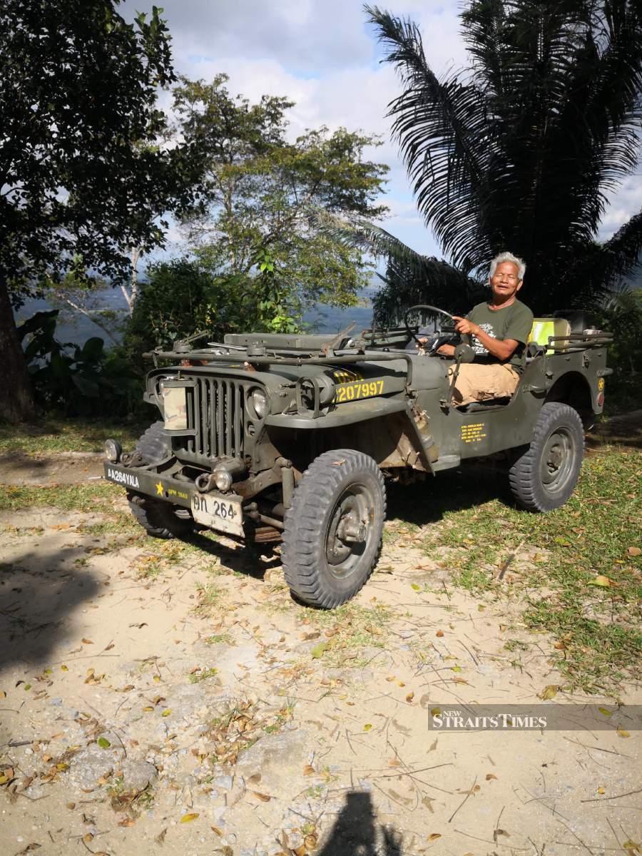  Phromsook with his beloved jeep.