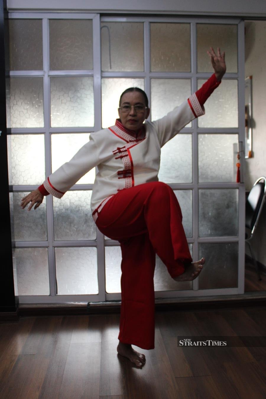  Thein shows a Thaing movement in her combat uniform.