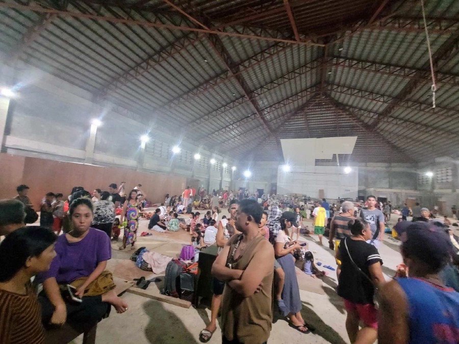 People gather at an evacuation center, in the aftermath of an earthquake, in Hinatuan, Surigao del Sur, Philippines. - REUTERS PIC