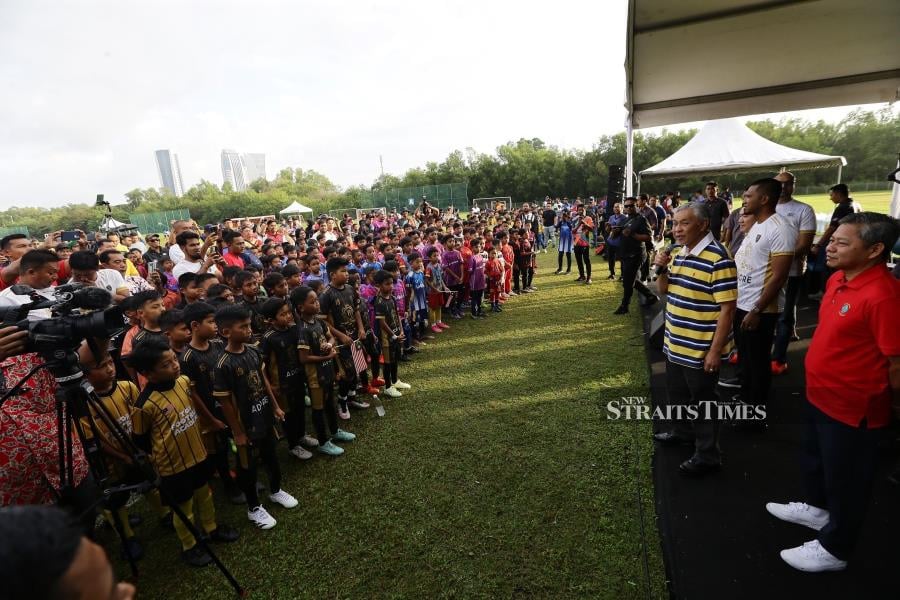 Deputy Prime Minister Datuk Seri Dr Ahmad Zahid Hamidi speaks before opening the Datuk Seri Dr Ahmad Zahidi Hamidi Cup Football Tournament in Putrajaya. -NSTP/MOHD FADLI HAMZAH