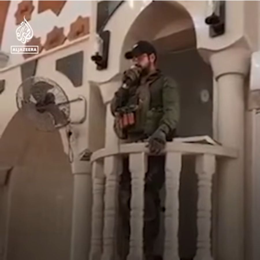 The soldier was recorded reciting prayers and songs inside a Jenin mosque. - Screengrab from Al Jazeera YouTube video.