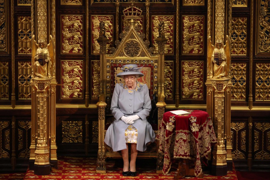 In this file photo taken on May 11, 2021 Britain's Queen Elizabeth II sits on the The Sovereign's Throne in the House of Lords chamber during the State Opening of Parliament at the Houses of Parliament in London on May 11, 2021, which is taking place with a reduced capacity due to Covid-19 restrictions. - AFP PIC