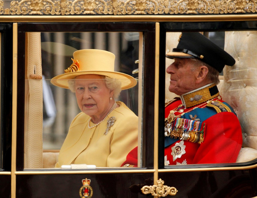 : Britain's Queen Elizabeth and Prince Philip travel to Buckingham Palace in a Semi-State Landau along the Procession Route after the wedding of Prince William and Kate Middleton in Westminster Abbey in central London, Britain. - REUUTERS PIC