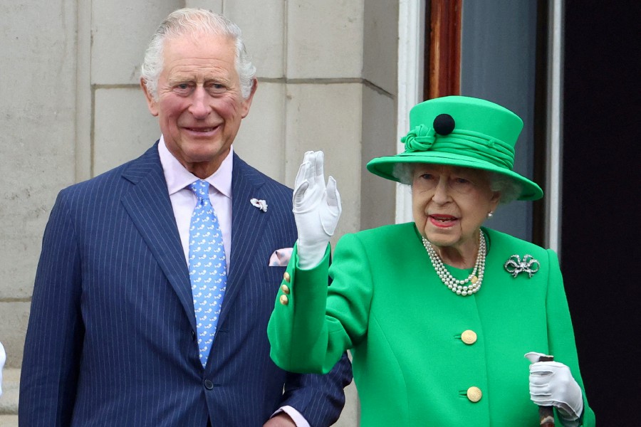 Britain's Queen Elizabeth and Prince Charles stand on a balcony during the Platinum Jubilee Pageant, marking the end of the celebrations for the Platinum Jubilee of Britain's Queen Elizabeth, in London, Britain. - REUTERS PIC