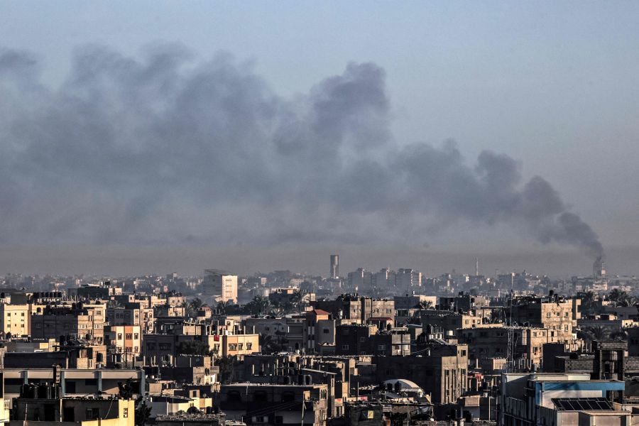 A picture taken from Rafah on January 6, 2024 shows smoke billowing over Khan Yunis in the southern Gaza Strip during Israeli bombardment, amid continuing battles between Israel and the Palestinian fighters group Hamas. - AFP pic
