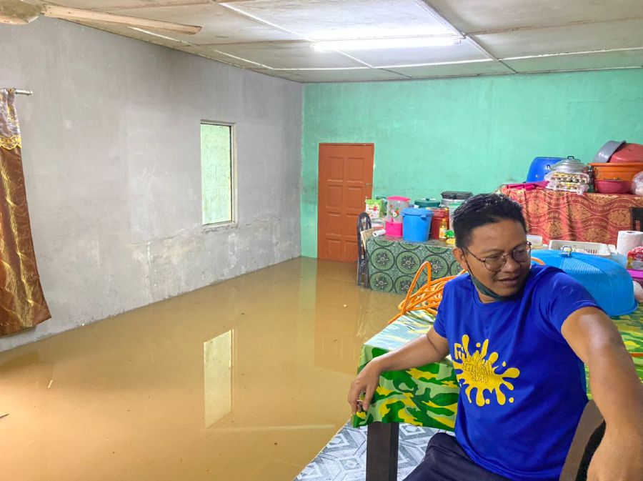 A resident checking his house at Kampung Ulu Dong in Raub today. - Pic courtesy of Raub Civil Defence Force (APM)