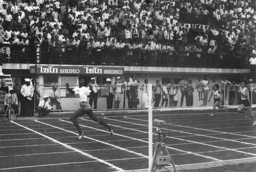 M. Rajamani dashes across the finish line to win the women’s 400 metres race at the Asian Games in Bangkok, Thailand in Dec 1966. She clocked 56.3 seconds, setting up a new Asian Games record.