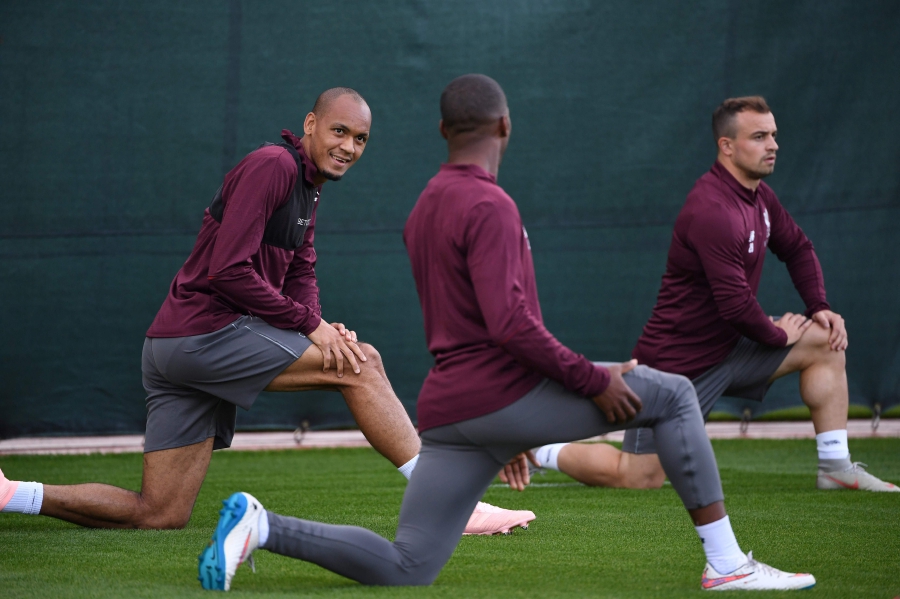  Liverpool's Fabinho talks with teammates during a training session at their Melwood training complex in Liverpool on Sept 17, 2018, on the eve of their Champions League match against Paris Saint-Germain. AFP pic