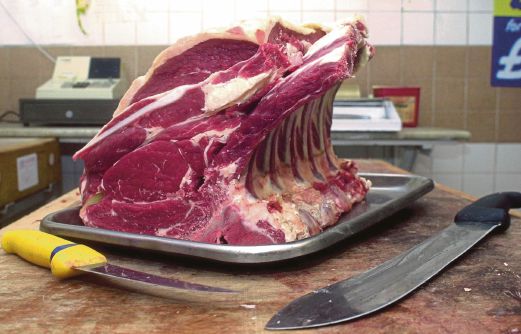 This picture shows a rib of English beef with the bone still on in Wotton-Under-Edge, England. Women who often indulge their cravings for hamburgers, steaks and other red meat may have a slightly higher risk of breast cancer, a new study suggests. Doctors have long warned that a diet loaded with red meat is linked to cancers including those of the colon and pancreas, but there has been less evidence for its role in breast cancer. AP Photo