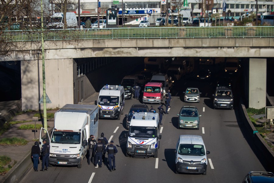  French police forces stand at a checkpoint on the Paris ring road to prevent members of the 'Freedom Convoy' from entering Paris, France. - EPA PIC