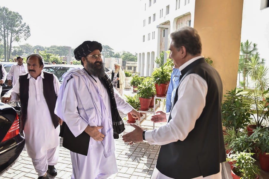 Hugs and smiles as Taliban meet Pakistan officials | New Straits Times ...