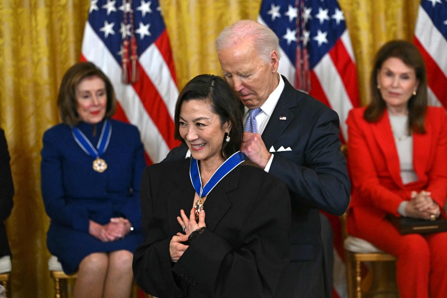 US President Joe Biden presents the Presidential Medal of Freedom to Malaysian actress Michelle Yeoh in the East Room of the White House in Washington, DC. - AFP PIC