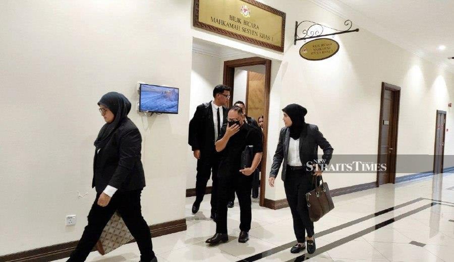 Sidu Edin (second right) leaving the courtroom after the trial in Kota Kinabalu. - NSTP/ Ersie Anjumin