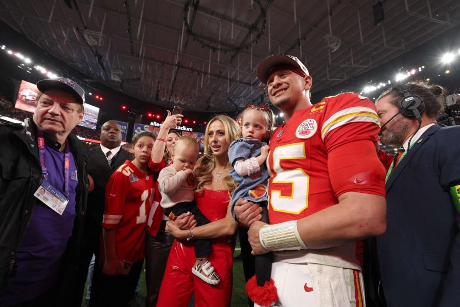 Patrick Mahomes of the Kansas City Chiefs celebrates with his family after defeating the San Francisco 49ers 25-22 in overtime during Super Bowl LVIII at Allegiant Stadium in Las Vegas, Nevada. -AFP PIC