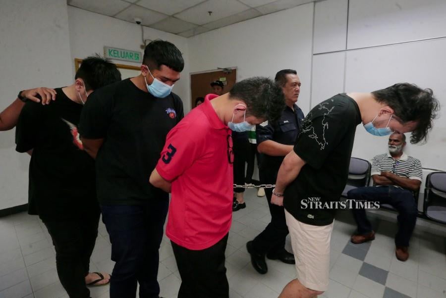 The accused are seen arriving at the Johor Baru magistrate’s court ahead of their trial. -NSTP/NUR AISYAH MAZALAN