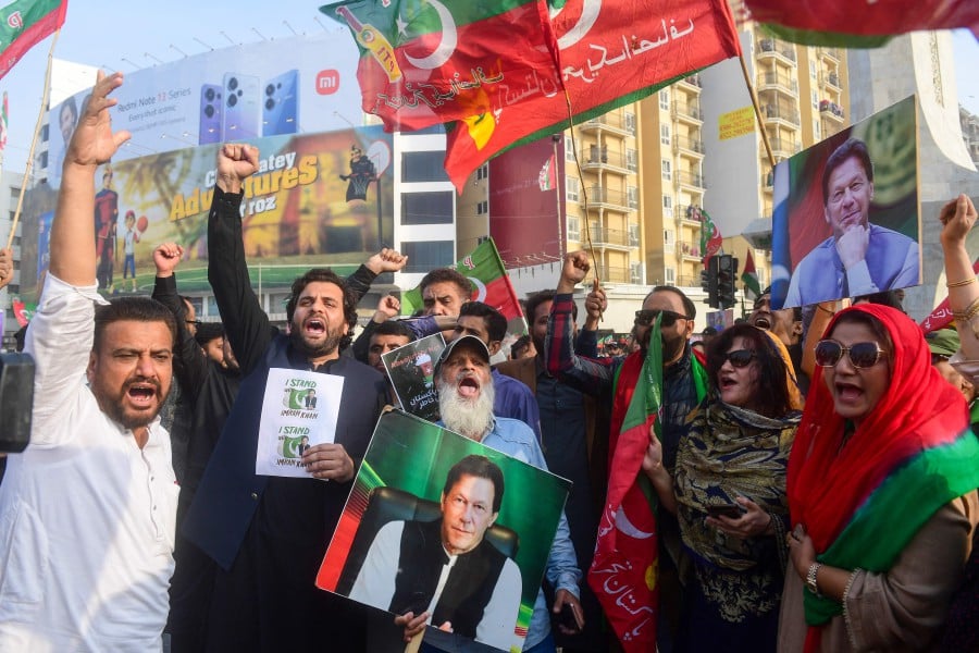 Supporters of Pakistan Tehreek-e-Insaf (PTI) party shout slogans and protest to demand the release of Pakistan’s jailed former prime minister Imran Khan, in Karachi on January 28. - AFP PIC