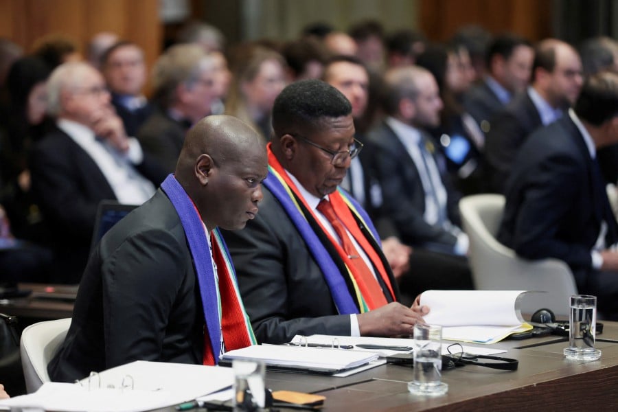South Africa's Minister of Justice Ronald Lamola and South African Ambassador to the Netherlands Vusimuzi Madonsela sit as judges at the International Court of Justice (ICJ) hear a request for emergency measures by South Africa, who asked the court to order Israel to stop its military actions in Gaza and to desist from what South Africa says are genocidal acts committed against Palestinians during the war with Hamas in Gaza, in The Hague, Netherlands. - AFP PIC