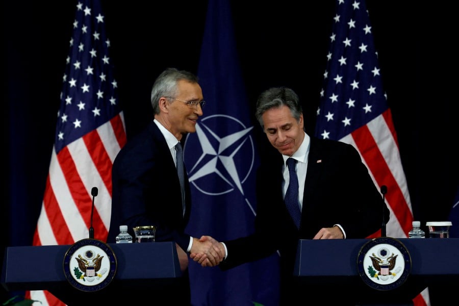 Nato Secretary-General Jens Stoltenberg and U.S. Secretary of State Antony Blinken shake hands during a press conference at the State Department in Washington. - REUTERS PIC
