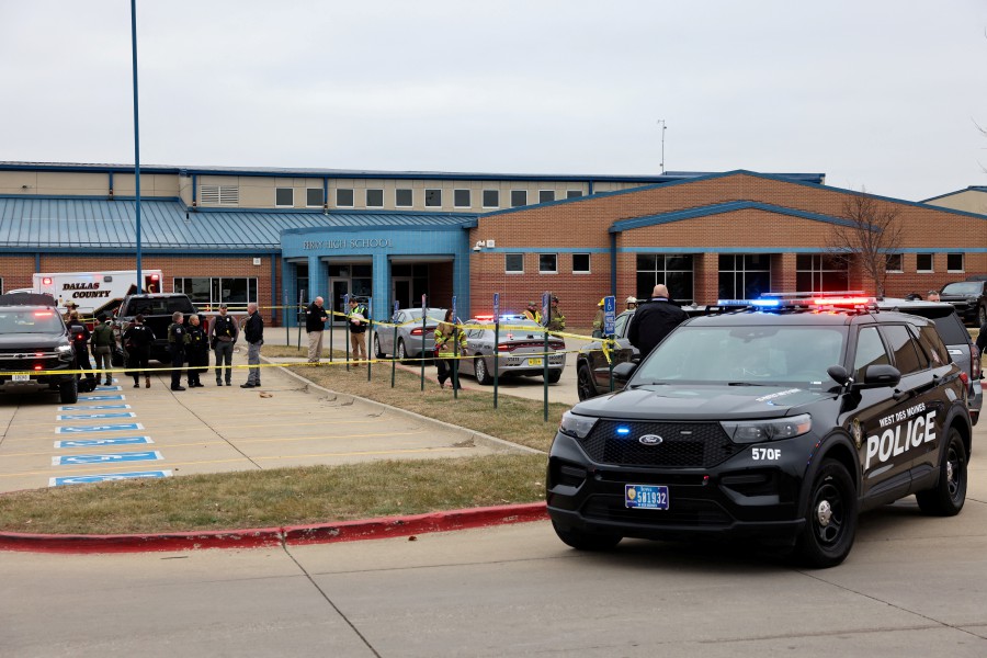 Law enforcement officers work at the scene of a shooting at Perry High School in Perry, Iowa. - REUTERS PIC