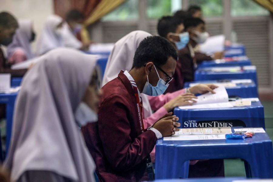 SPM candidates taking their exams at Sekolah Menengah Sains Sultan Mahmud in Kuala Nerus. -NSTP/GHAZALI KORI