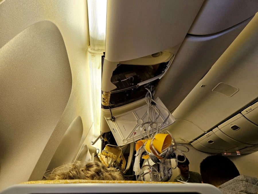 The interior of Singapore Airlines flight SQ321 is pictured after an emergency landing at Bangkok's Suvarnabhumi International Airport, in Bangkok. - REUTERS PIC